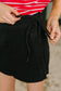 Bentli High Rise Side Tie Denim Skort in Black